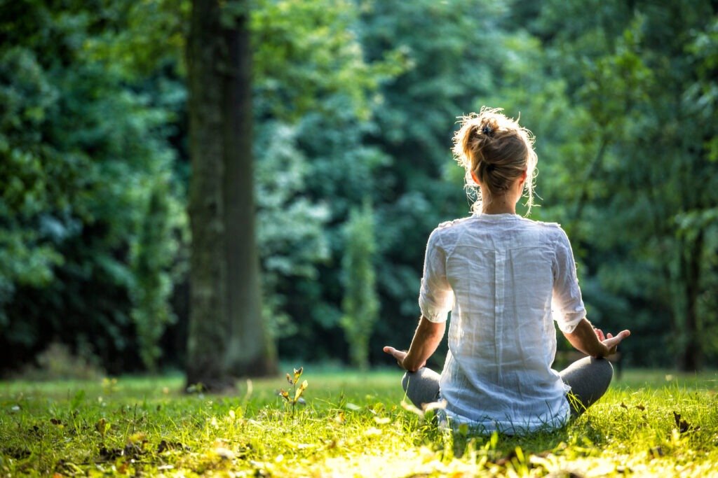 woman sitting in the grass