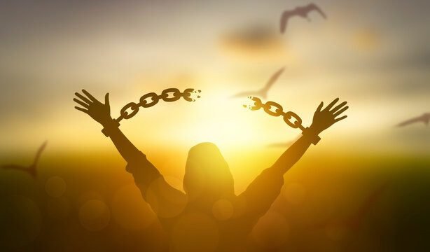 person breaking free of chains